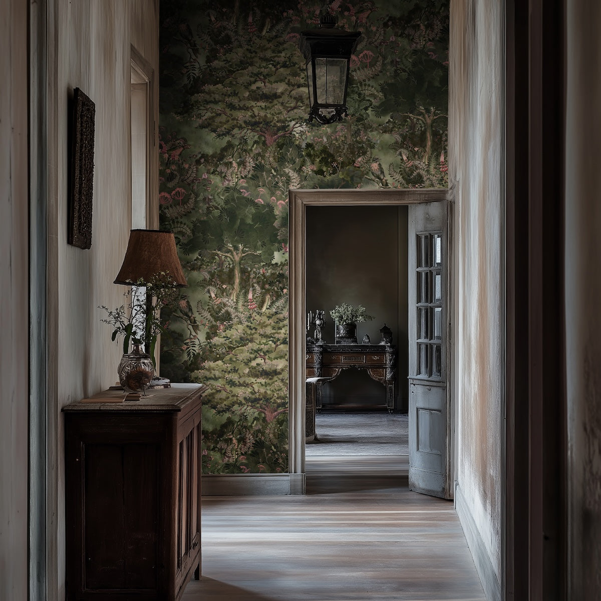 Arcadia wallpaper by Kate Walton in a hallway: hand-painted English countryside with trees, wildflowers and wildlife