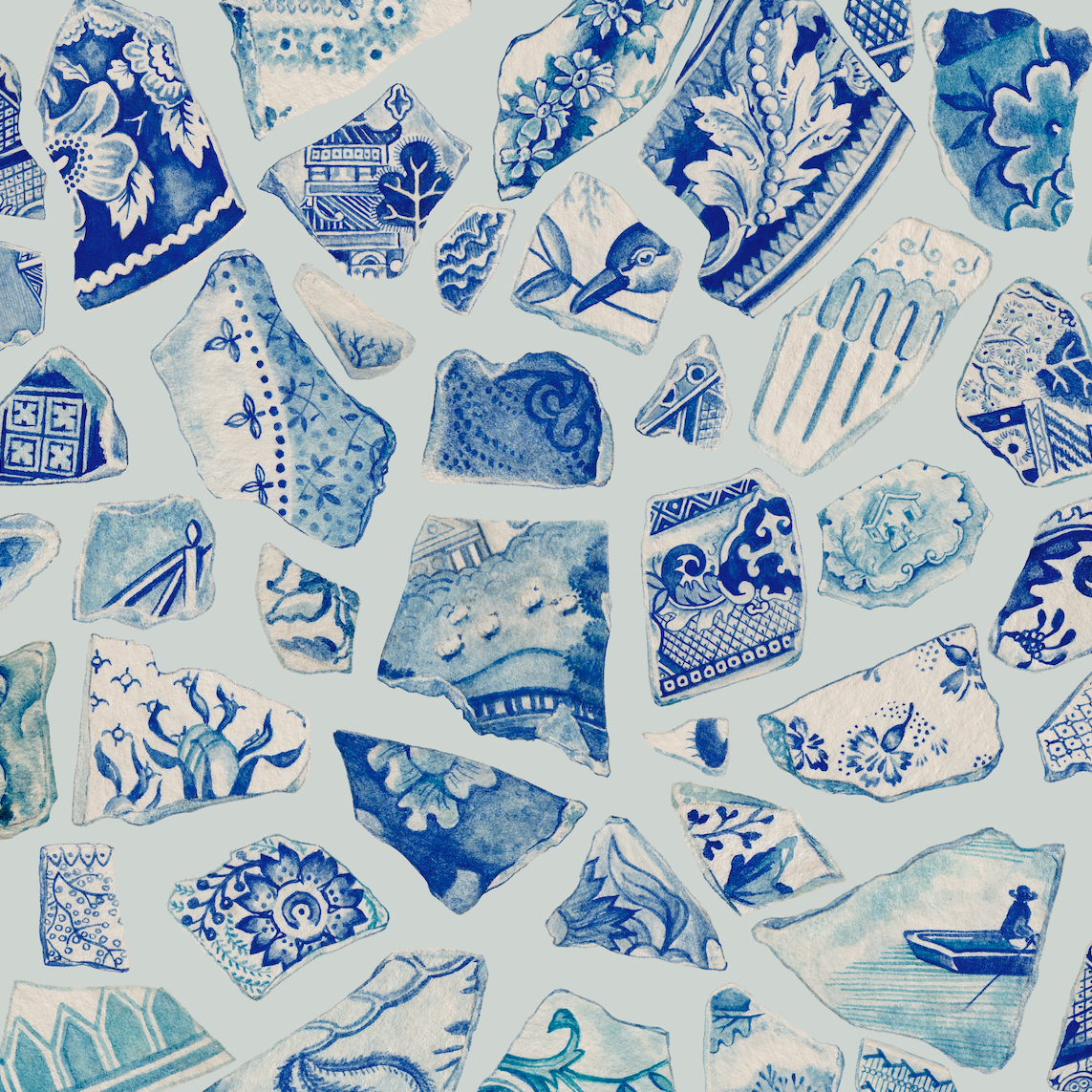 Pattern of blue and white ceramic shards with intricate designs on a white background